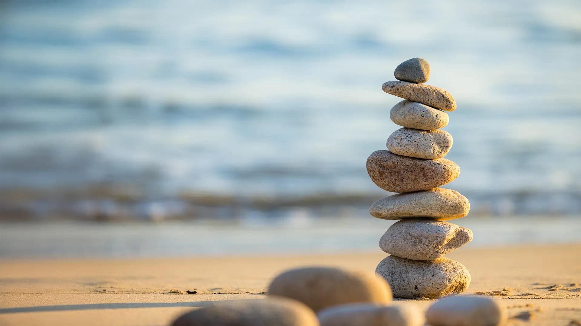 stacked stones on seashore